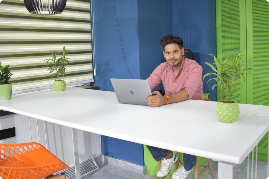 Team member analyzing funnel strategy on a laptop during the clarity and value stage of CF Funnels’ approach.