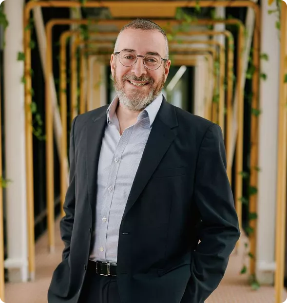 Professional photo of David Werdiger featured in the CF Funnels success story, representing the client behind the website redesign and funnel integration project.