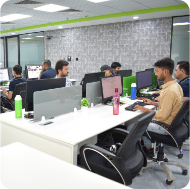 CF Funnels team working collaboratively in an open office environment to build funnel projects.