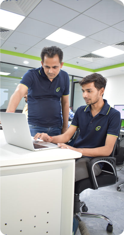 Two CF Funnels team members reviewing funnel components and collaborating on improvements.