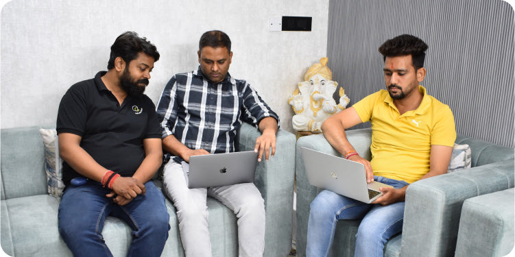 CF Funnels team members collaborating on funnel ideas during an informal workspace discussion.